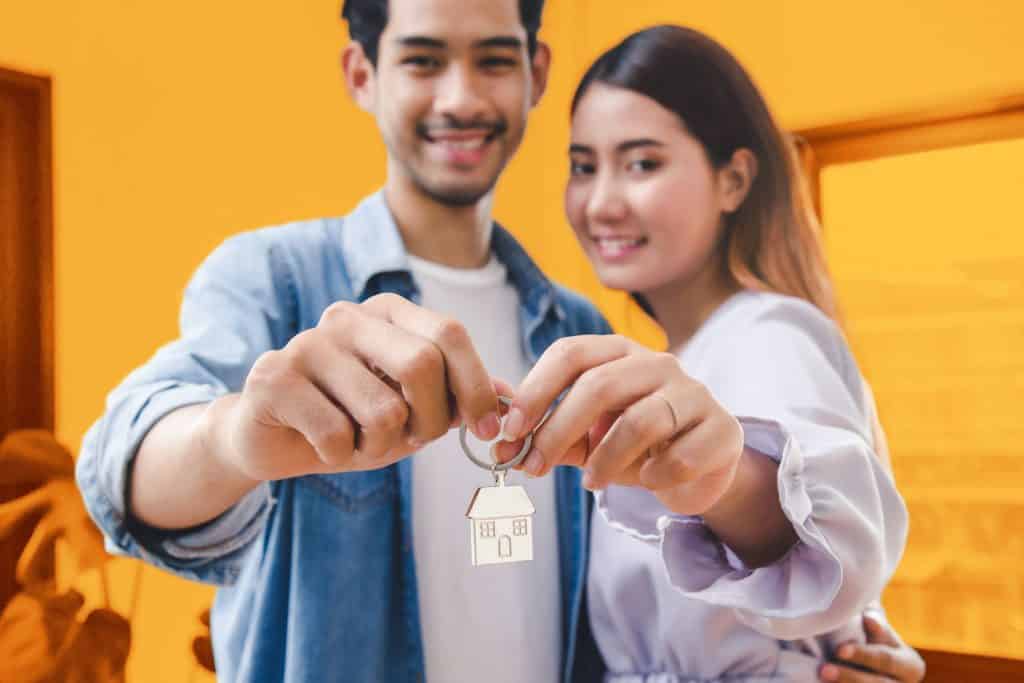 A couple with their own home keys through a Renters Advantage loan
