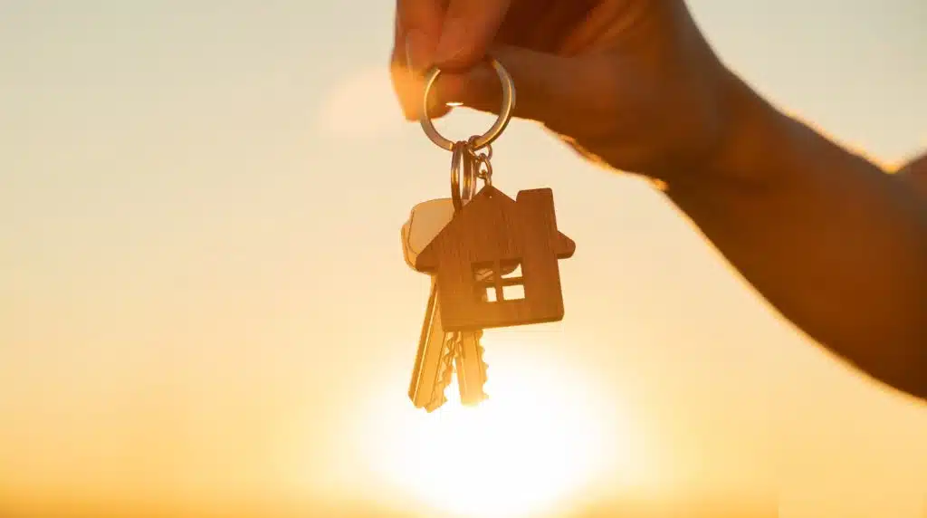 Hands holding keys in the sun