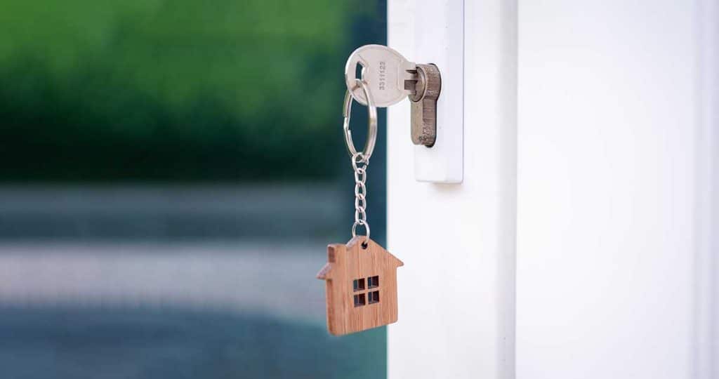 White door with a home keychain