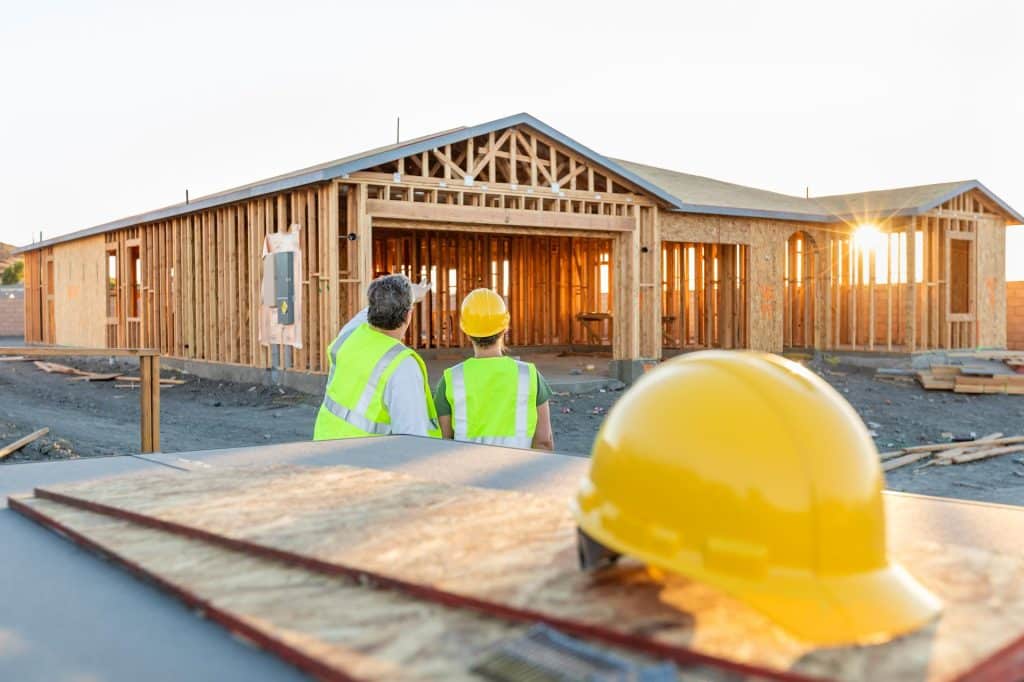 Construction of new home with a Yellow hard hat