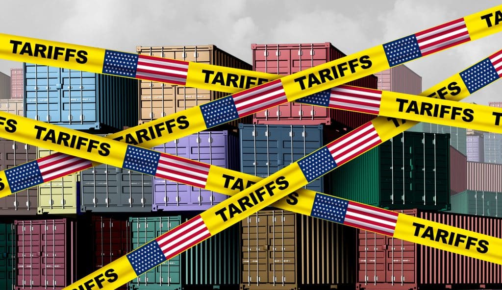 Crates in a shipping yard with Yellow Tariff Tape