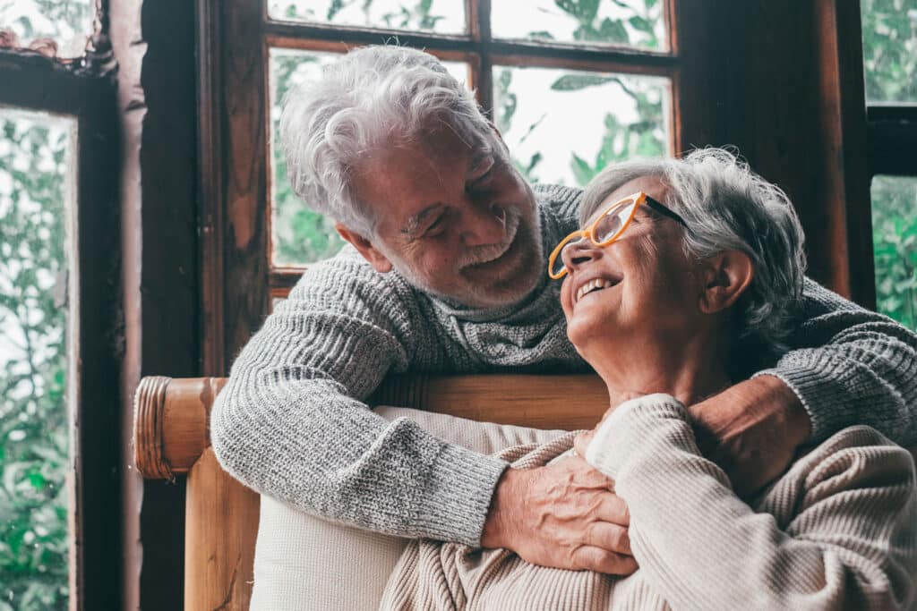 Boomersd hugging in their home